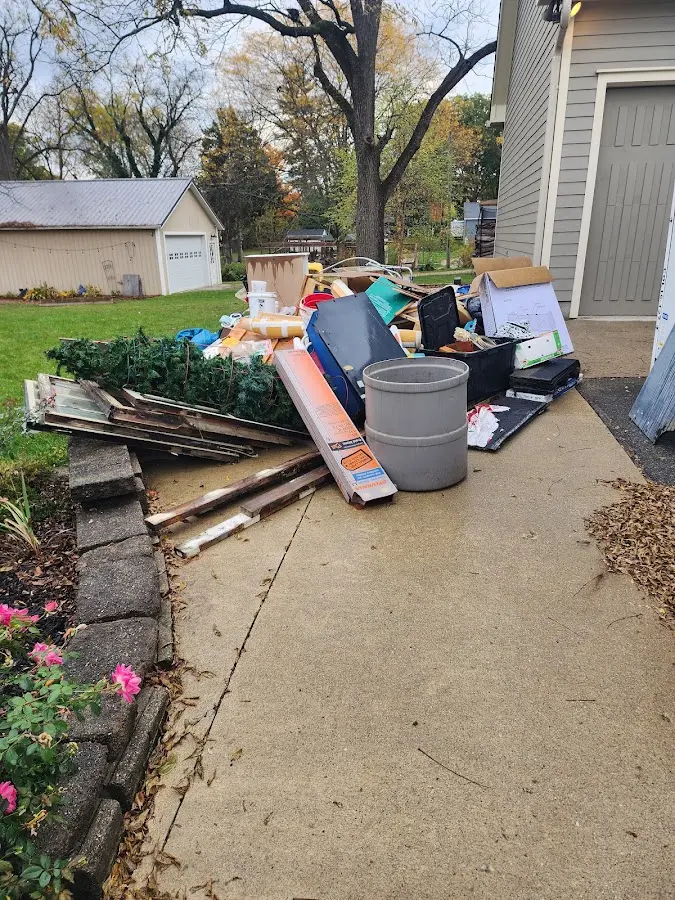 Dumpster being loaded with debris for 3 Yard Dumpster Rental in Schuyler
